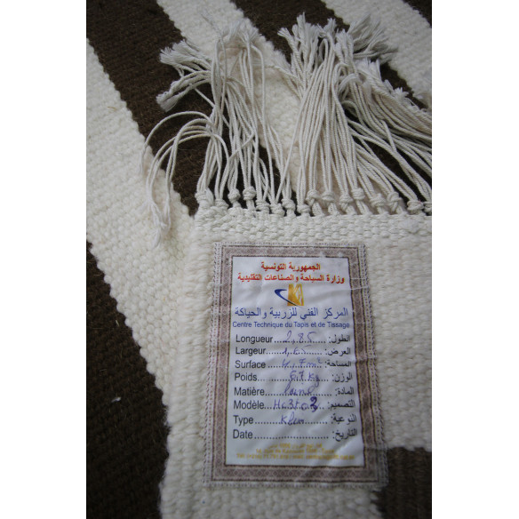 Elegant Kilim rug with rectilinear hand-woven shapes.